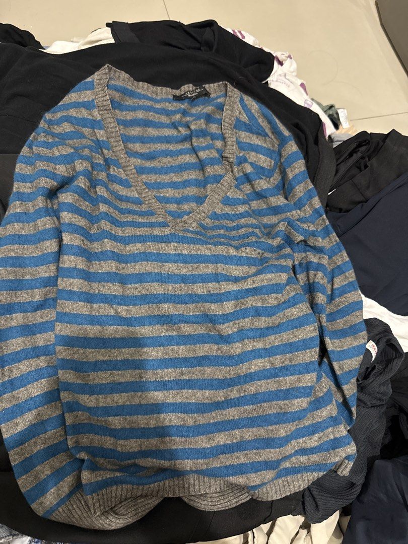 Blue and Grey Striped V-Neck Sweater (Category: Longsleeves) located in Manila. Submitted by hiiipurple (Listing ID 1459795602, Image 1). Description: - Cozy long-sleeved sweater - Blue and grey horizontal stripes - Flattering V-neckline - Comfortable knit fabric - Ideal for layering or standalone wear - Versatile: pairs well with jeans or skirts - Timeless striped design.