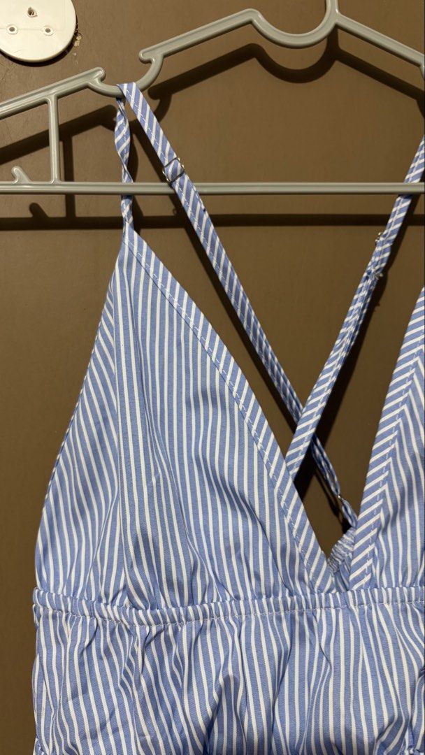 Blue and White Striped Peplum Cami Top (Category: Sleeveless) located in Caloocan City. Submitted by zandrarubio (Listing ID 1459724997, Image 3). Description: - Cute blue and white striped cami top - Flattering V-neckline - Stylish criss-cross straps at the back - Elasticated waist for a comfortable fit - Peplum hem for a feminine touch - Ideal for casual outings or beach days - Versatile: pair with shorts or a skirt.