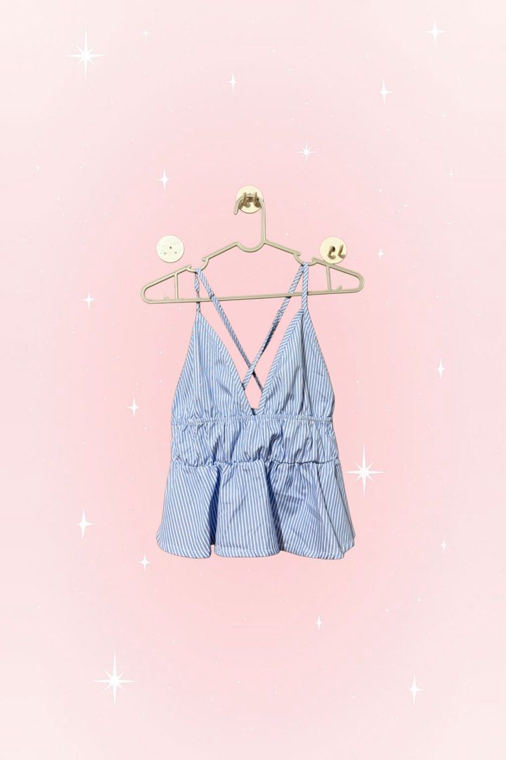 Blue and White Striped Peplum Cami Top (Category: Sleeveless) located in Caloocan City. Submitted by zandrarubio (Listing ID 1459724997, Image 1). Description: - Cute blue and white striped cami top - Flattering V-neckline - Stylish criss-cross straps at the back - Elasticated waist for a comfortable fit - Peplum hem for a feminine touch - Ideal for casual outings or beach days - Versatile: pair with shorts or a skirt.