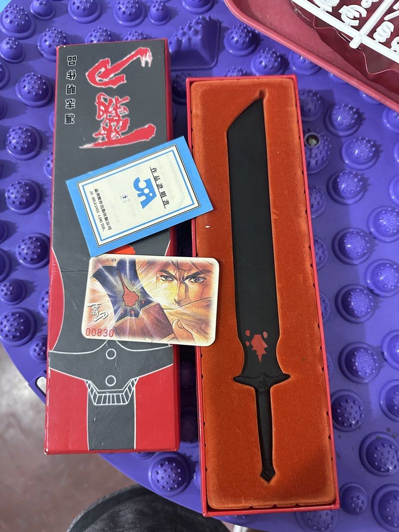 "Bàodāo" (霸刀) Super Alloy Dominant Blade miniature (Category: Figurines & Statues) located in Baguio. Submitted by cherylcaps95 (Listing ID 1459763535, Image 1). Description: This is a collectible 12-inch “Badao” (覇刀) alloy weapon replica and letter opener based on the Hong Kong manhua by artist Fung Chi Ming. Item Details Subject: The legendary saber Badao from the namesake martial arts comic series. Features: Matte black finish, distinctive blo