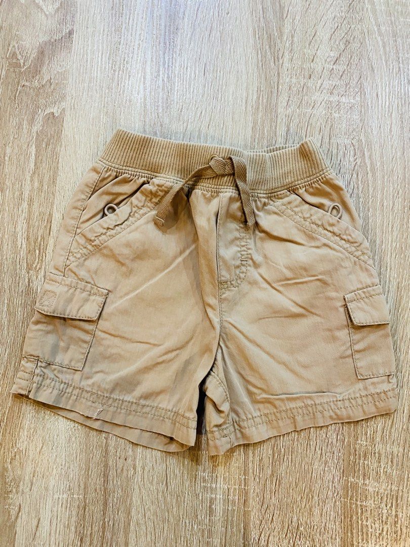 Boys Tan Cargo Shorts with Drawstring Waist (Category: Babies & Kids Fashion) located in Indang. Submitted by matilde.sshop (Listing ID 1459888985, Image 1). Description: - Tan cargo shorts for boys - Elastic waistband with drawstring tie - Two side pockets - Two cargo pockets on the legs - Ideal for everyday wear and play - Easy pull-on style.
