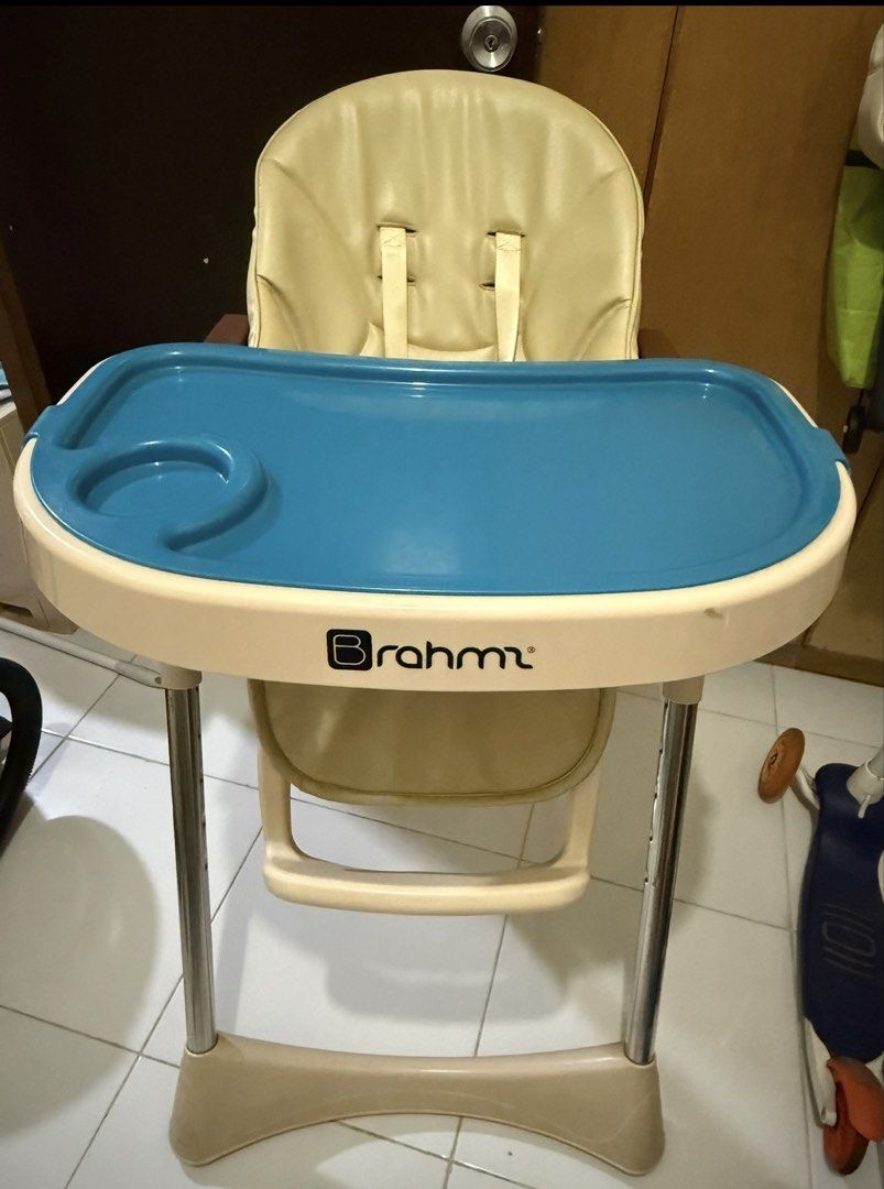 Brahm High Chair with Blue Tray (Category: Baby High Chairs) located in Bacoor. Submitted by annemargarett (Listing ID 1459881686, Image 2). Description: - Braum high chair - Cream seat with blue tray - Built-in cup holder - Safety straps included - Sturdy and stable legs - Easy-to-clean material - Ideal for making meal times enjoyable and safe.
