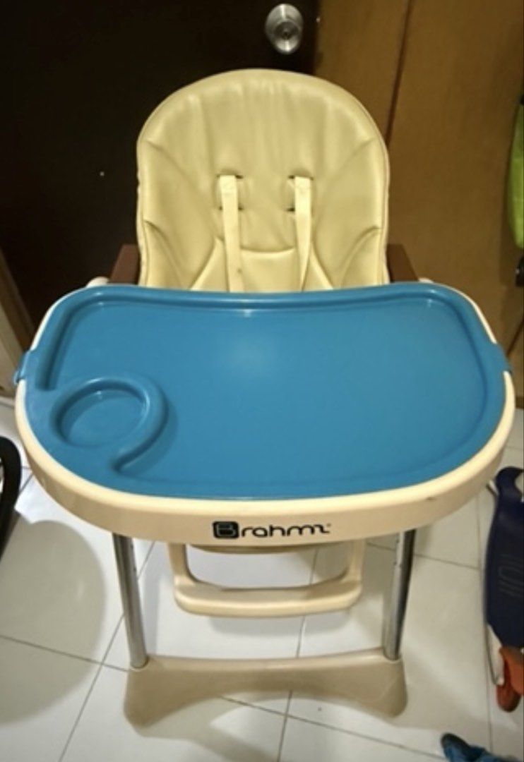 Brahm High Chair with Blue Tray (Category: Baby High Chairs) located in Bacoor. Submitted by annemargarett (Listing ID 1459881686, Image 1). Description: - Braum high chair - Cream seat with blue tray - Built-in cup holder - Safety straps included - Sturdy and stable legs - Easy-to-clean material - Ideal for making meal times enjoyable and safe.