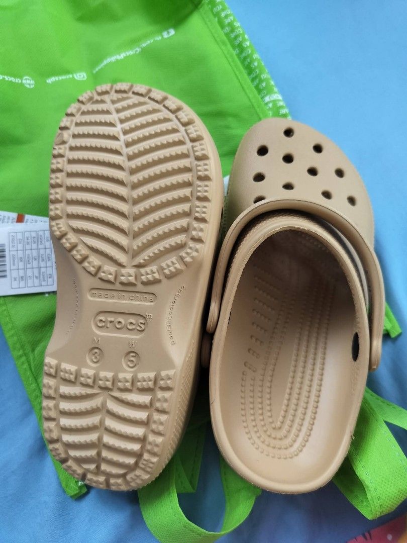 Brandnew Original Crocs (Category: Slippers and slides) located in Manila. Submitted by littlemiss84 (Listing ID 1459895635, Image 3). Description: moneyback guarantee if proven fake size indicated in the photo.