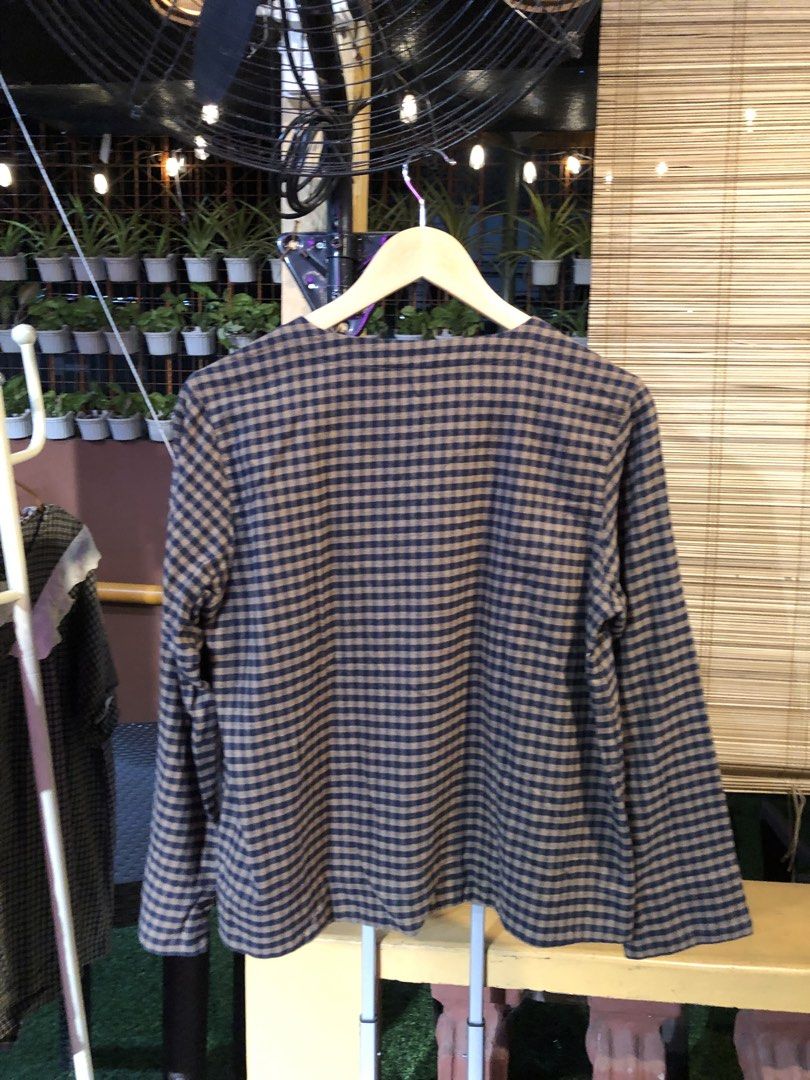 Brown and Black Gingham Long Sleeve Shirt (Category: Longsleeves) located in Cauayan City . Submitted by wholly.craaaft (Listing ID 1459808183, Image 3). Description: - Brown and black checkered long-sleeved shirt - Comfortable fit - Ideal for casual wear - Pairs easily with jeans or shorts - Simple and classic design.