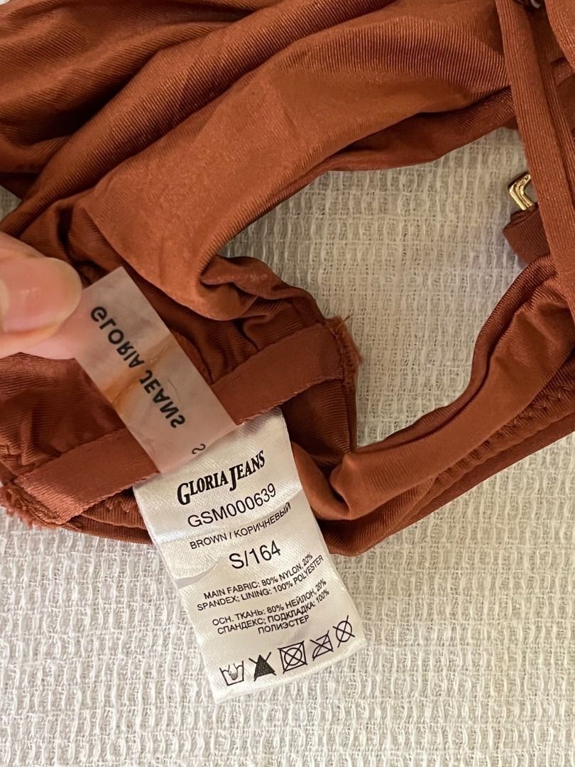 Brown Bikini Top (Category: Bikinis & Swimsuits) located in Caloocan City. Submitted by fishfilei (Listing ID 1459781971, Image 3). Description: Details: • Size on tag: Small • Adjustable straps • No pads • Material details are shown on the tag (see photos) Mode of Payment (MOP): • GCash • BDO / BPI / Metrobank • Bank transfer via QR code Mode of Delivery (MOD): • J&T • Lalamove / Grab Express Reason for Selling (RFS): • Decluttering.