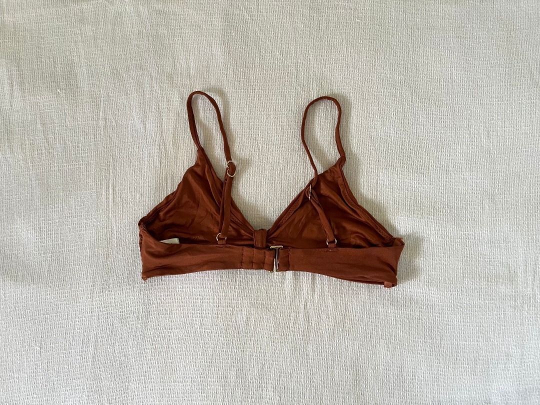 Brown Bikini Top (Category: Bikinis & Swimsuits) located in Caloocan City. Submitted by fishfilei (Listing ID 1459781971, Image 2). Description: Details: • Size on tag: Small • Adjustable straps • No pads • Material details are shown on the tag (see photos) Mode of Payment (MOP): • GCash • BDO / BPI / Metrobank • Bank transfer via QR code Mode of Delivery (MOD): • J&T • Lalamove / Grab Express Reason for Selling (RFS): • Decluttering.