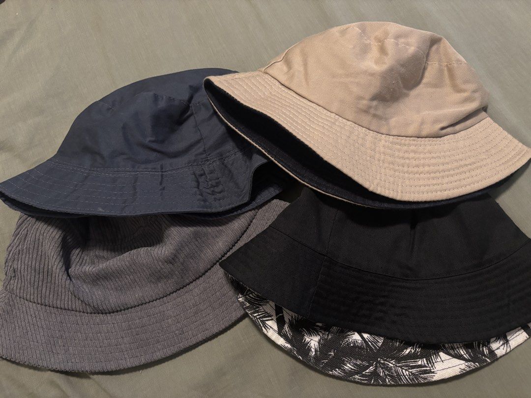 Bundle of 4 Bucket Hats - Various Colors (Category: Hats & Beanies) located in Quezon City. Submitted by lbpapparel (Listing ID 1459743321, Image 1). Description: - Bundle of 4 bucket hats - Includes: Navy blue, Tan, Grey corduroy, Black with palm leaf lining - Perfect for sunny days and adding a casual vibe to your outfit - Great addition to your collection 100 each.