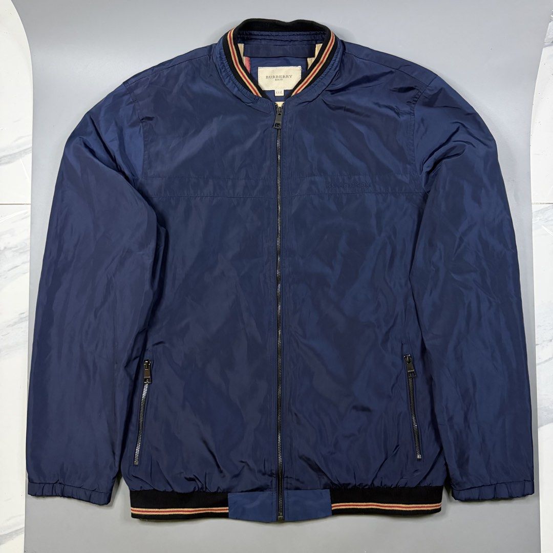 Burberry - Lightweight Nylon Bomber Jacket Navy Blue (Category: Coats, Jackets and Outerwear) located in Paranaque City. Submitted by millennial_goodz (Listing ID 1459878116, Image 1). Description: WTS Burberry - Lightweight Nylon Bomber Jacket Navy Blue Size XL Frame Dimensions: 23.5" / 29.5" Excellent condition - No issues Authentic P1,999 only DM.