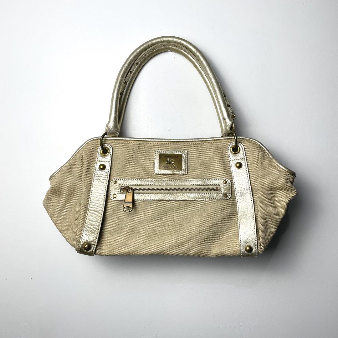 Burberry Blue Label Canvas Shoulder Bag (Category: Luxury Bags & Wallets) located in Baguio. Submitted by metro_studio (Listing ID 1459723317, Image 2). Description: Authentic In Great Condition *may need some minor cleaning here n there Canvas of this is THICC, spacious bag too!.