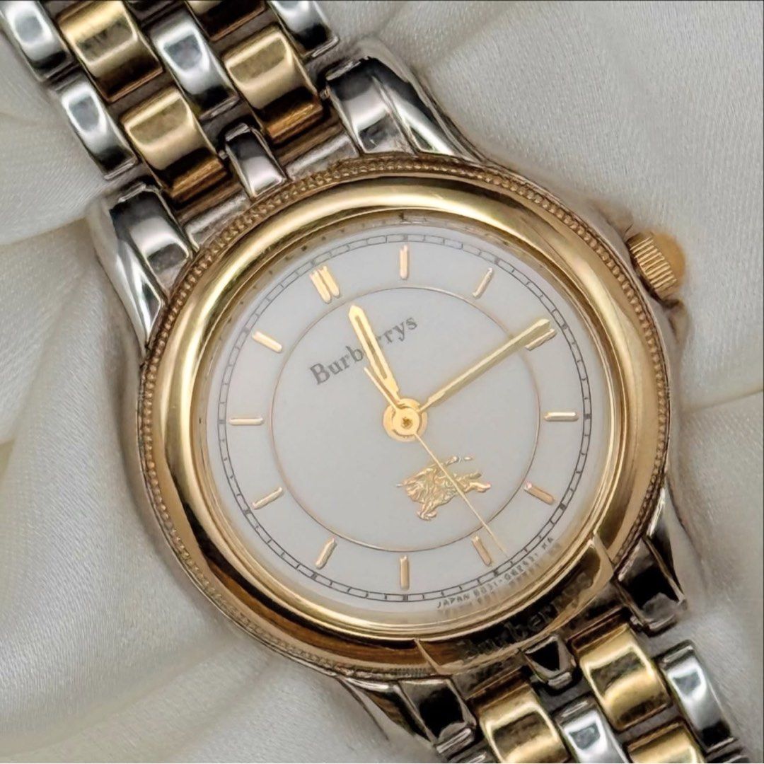 Burberry Two-Tone Watch (Category: Luxury Watches) located in Lipa City. Submitted by watchoutph (Listing ID 1459825877, Image 3). Description: Burberrys Two-toned Watch Gold bezel Cream dial Gold hands and indices 16.5cm wrist size 24mm case size ₱7,800.