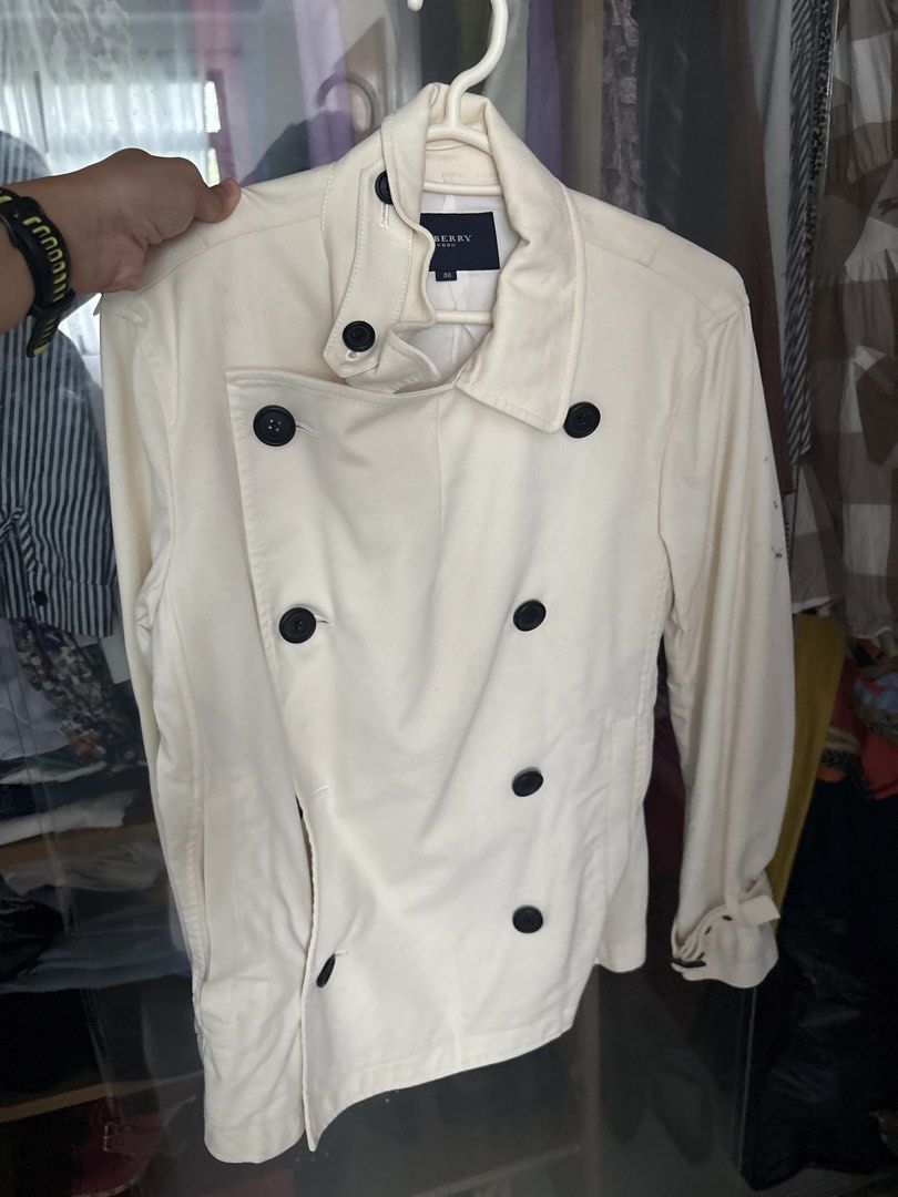 Burberry white coat (Category: Coats, Jackets and Outerwear) located in Quezon City. Submitted by mileena3 (Listing ID 1459780281, Image 1). Description: It has stain but overall it’s lightly used. Hindi ko pa po natatry lagyan ng anything para mawala ang stain but I think possible mawala .