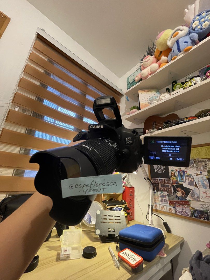 Canon EOS 700D DSLR Camera with Lens (Category: Cameras) located in Bacoor. Submitted by decluttering.gadget (Listing ID 1459797982, Image 1). Description: Selling my Canon EOS 700D. It's a great DSLR for beginners and enthusiasts. Comes with a Canon lens. The screen shows it's in 'Scene Intelligent Auto' mode. Shutter count is 7416. Works well. Ready for your next photo adventure..