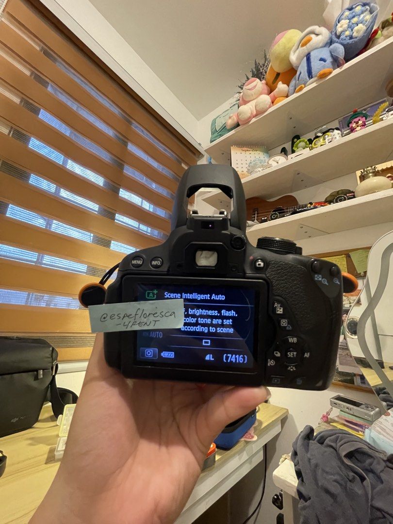 Canon EOS 700D DSLR Camera with Lens (Category: Cameras) located in Bacoor. Submitted by decluttering.gadget (Listing ID 1459797982, Image 3). Description: Selling my Canon EOS 700D. It's a great DSLR for beginners and enthusiasts. Comes with a Canon lens. The screen shows it's in 'Scene Intelligent Auto' mode. Shutter count is 7416. Works well. Ready for your next photo adventure..