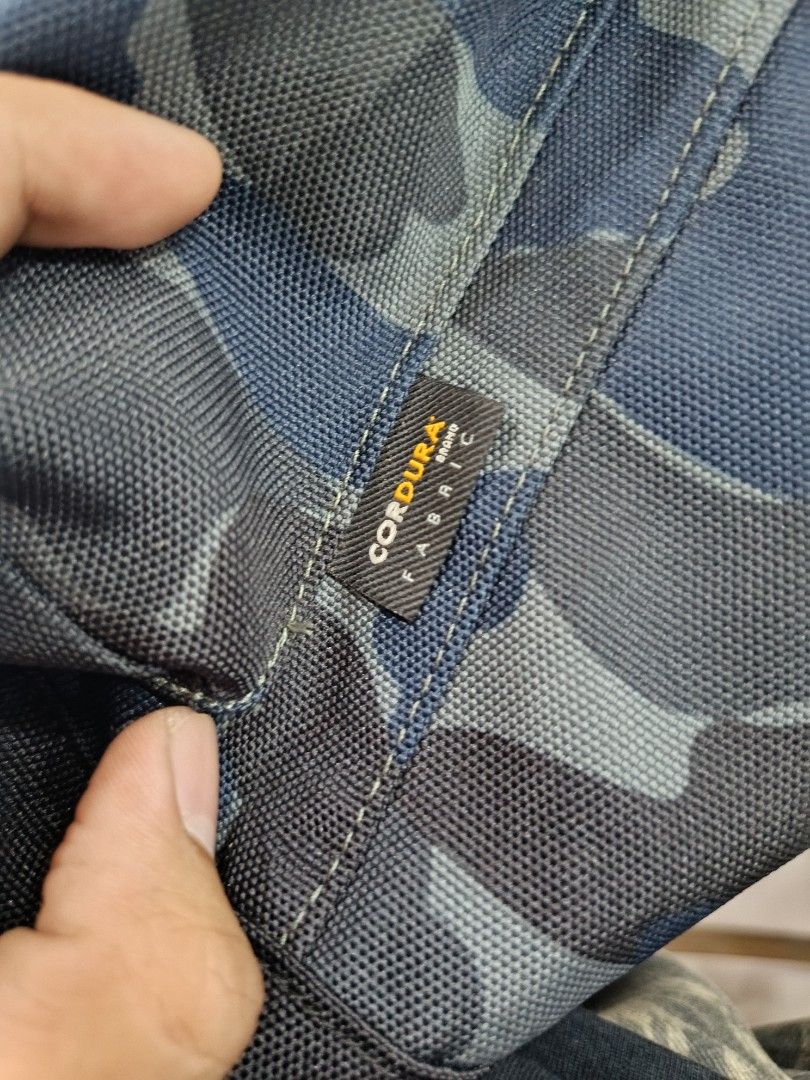 Carhartt Camo Cordura Backpack (Category: Backpacks) located in Manila. Submitted by silent_boss_g (Listing ID 1459697235, Image 2). Description: - Durable Carhartt backpack in blue camouflage. - Made with tough Cordura fabric. - Multiple zippered compartments for organization. - Internal pocket included. - Smooth YKK zippers. - Padded shoulder straps for comfort. - Ideal for daily use or travel..