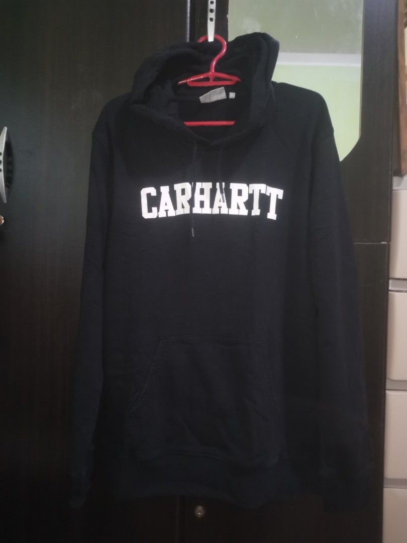 Carhartt Work In Progress Hooded College Sweat (Category: Coats, Jackets and Outerwear) located in Quezon City. Submitted by elihur.tuazon (Listing ID 1459809717, Image 2). Description: - Black Carhartt Hoodie - College sweat style with white lettering - Size: Large (L) - Material: 100% Cotton - Origin: Made in Bangladesh - Perfect for casual wear - Comfortable and durable.