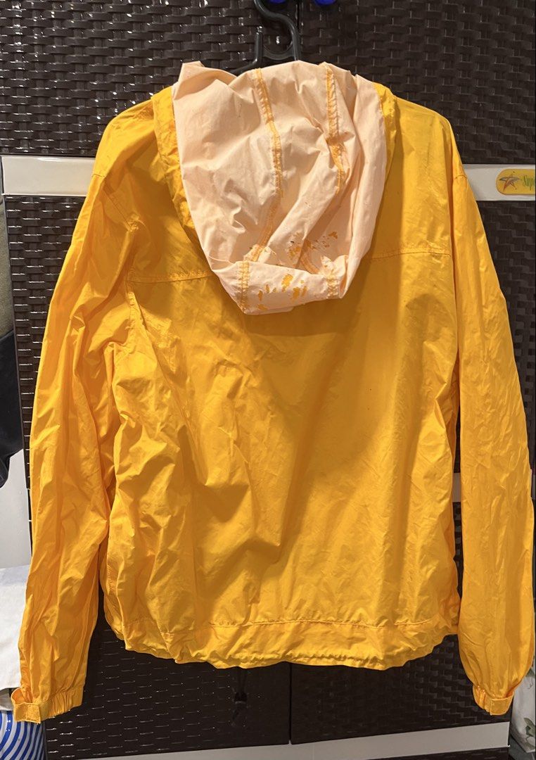 CAT Caterpillar Yellow Anorak Windbreaker Jacket (Category: Coats, Jackets and Outerwear) located in Subic. Submitted by round.thrift (Listing ID 1459712192, Image 2). Description: - Yellow CAT anorak windbreaker jacket - Quarter zip closure - Mesh lining for breathability - Front pouch pocket - Side zip pockets for secure storage - Reflective strip across the chest for visibility - Hooded design for extra protection - Expired waterproofing - Ide