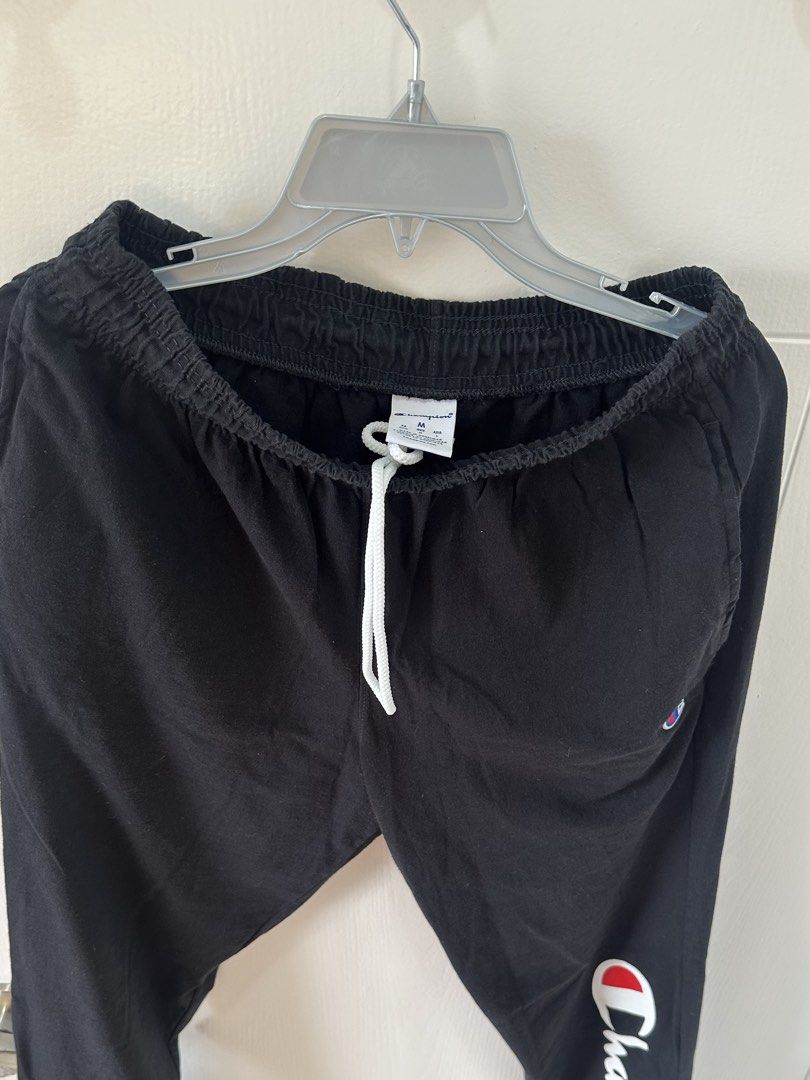 Champion Black Joggers Sweatpants Medium (Category: Other Bottoms) located in Pasay City. Submitted by behua (Listing ID 1459742094, Image 3). Description: - Black Champion joggers - Size: Medium (M) - Elastic waistband with adjustable drawstring - Champion logo on left hip - Large Champion logo on right leg - Ribbed cuffs for a snug fit - Perfect for casual wear, lounging, or workouts No meet up No issues Rfs decluttering .