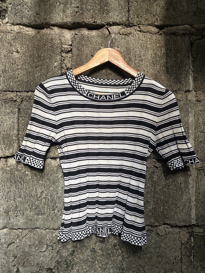Chanel Black & White Striped Knit Top (Category: Luxury Apparel) located in Manila. Submitted by assortedgoodsv3 (Listing ID 1459720400, Image 1). Description: - Chanel knit top - Size: 36 - Color: Black and white stripes - Design: Checkerboard trim - Features: 'CHANEL' logo on collar, cuffs, and hem - Origin: Made in Italy - Condition: Great piece for any fashion lover.