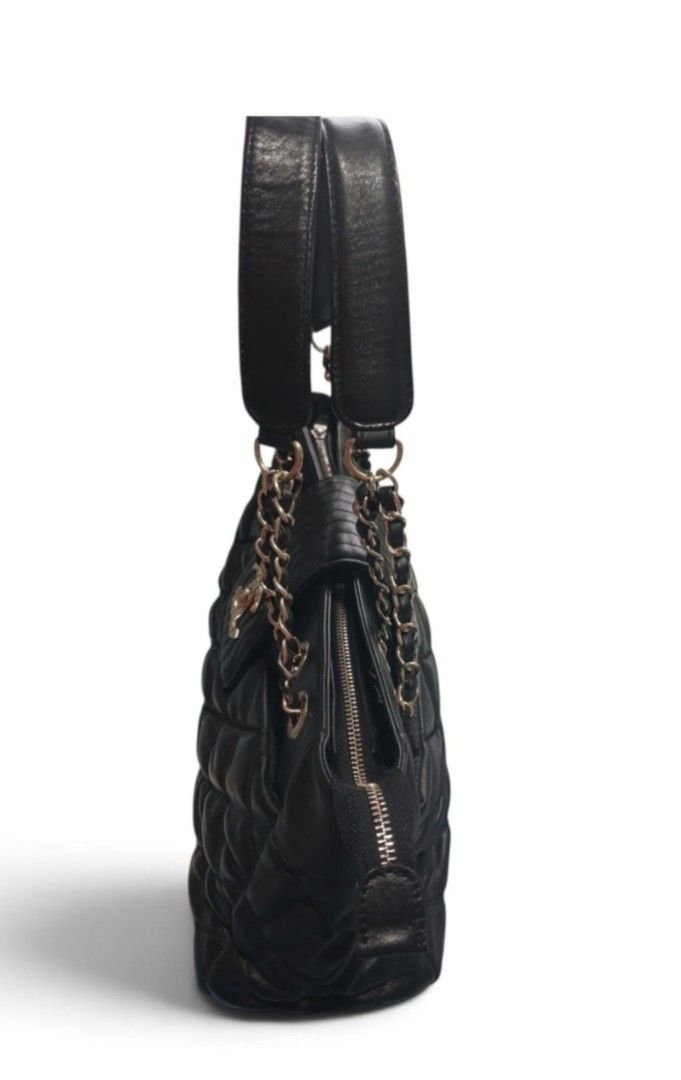 Chanel Black Quilted Leather Chain Shoulder Bag (Category: Luxury Bags & Wallets) located in Umingan. Submitted by mrobvariety (Listing ID 1459841675, Image 3). Description: Black quilted leather Chanel shoulder bag. Features a flap closure with the iconic CC logo. Silver chain straps with leather accents. Plenty of space inside for your essentials. A classic piece to add to your collection. Great for everyday use or special occasions..