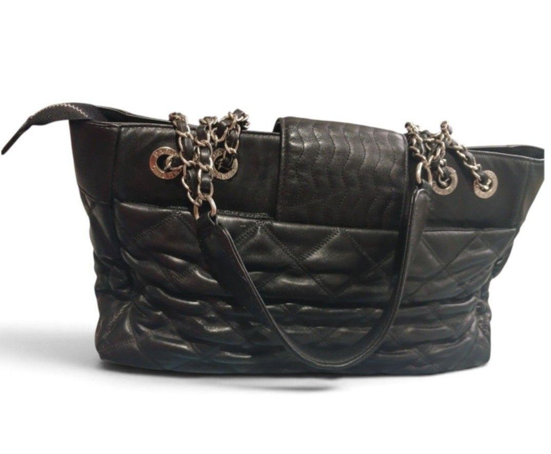 Chanel Black Quilted Leather Chain Shoulder Bag (Category: Luxury Bags & Wallets) located in Umingan. Submitted by mrobvariety (Listing ID 1459841675, Image 2). Description: Black quilted leather Chanel shoulder bag. Features a flap closure with the iconic CC logo. Silver chain straps with leather accents. Plenty of space inside for your essentials. A classic piece to add to your collection. Great for everyday use or special occasions..
