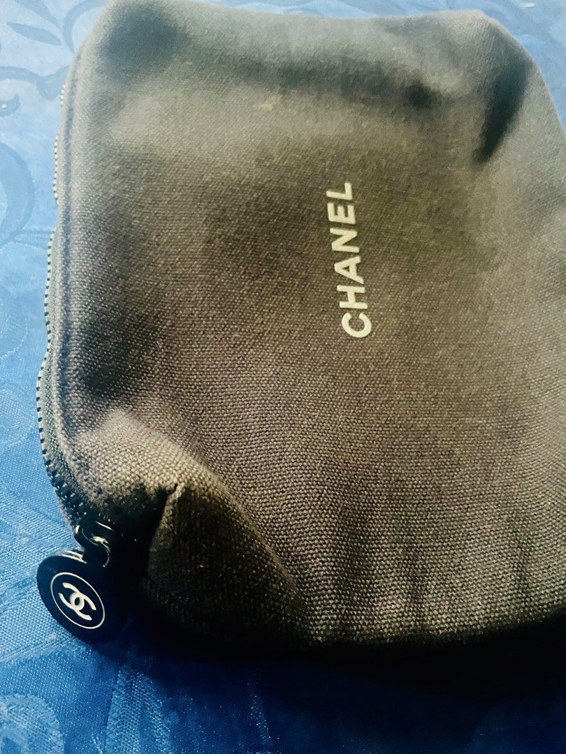 Chanel Cosmetic Pouch (Category: Looking For) located in Caloocan City. Submitted by hardestea2026 (Listing ID 1459885565, Image 2). Description: - Authentic Chanel pouch - Dark brown canvas material - Zipper closure with Chanel logo charm - Black interior - Ideal for makeup or small essentials - Clean inside and out - Great for travel or daily use.