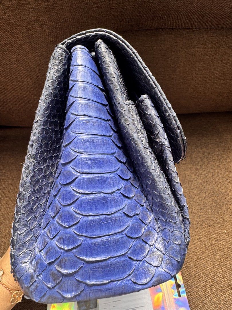 Chanel Python Flap Bag with Certificate of Authenticity (Category: Luxury Bags & Wallets) located in Quezon City. Submitted by derill_shop (Listing ID 1459812087, Image 3). Description: - Genuine blue python skin flap bag - Elegant silver chain strap - Iconic CC clasp for a touch of luxury - Comes with Certificate of Authenticity from Entropy - Unique texture and striking color - Perfect statement piece to elevate any outfit.