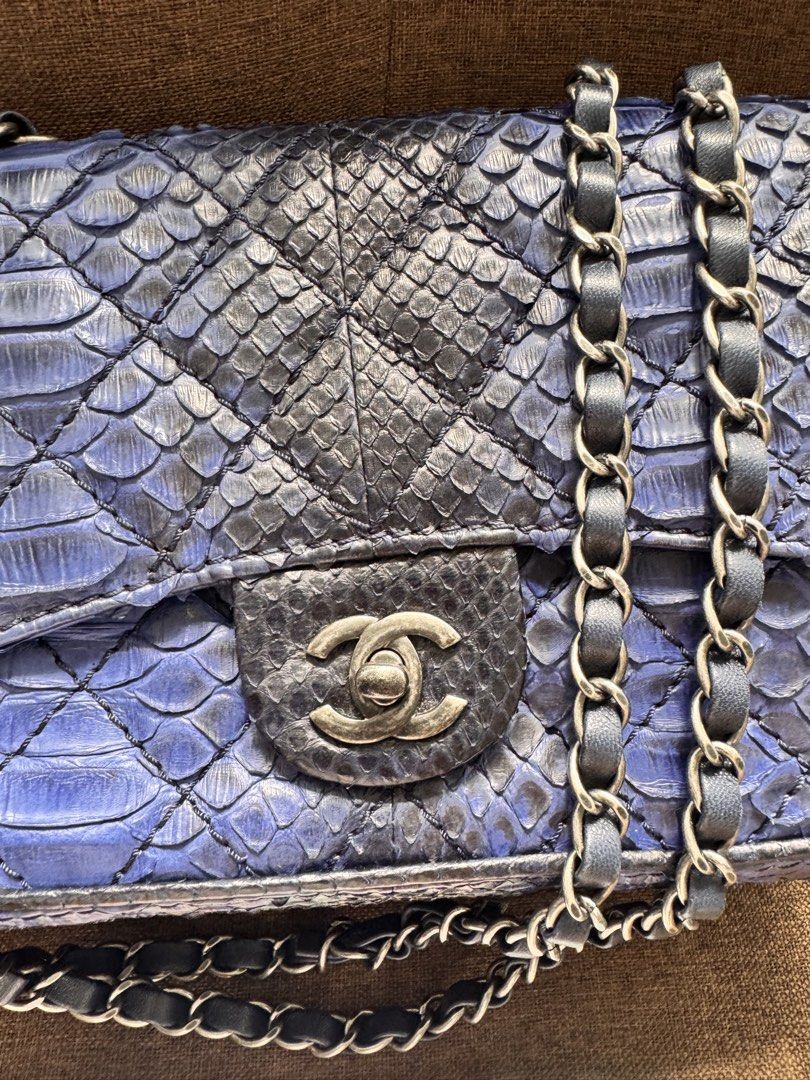 Chanel Python Flap Bag with Certificate of Authenticity (Category: Luxury Bags & Wallets) located in Quezon City. Submitted by derill_shop (Listing ID 1459812087, Image 2). Description: - Genuine blue python skin flap bag - Elegant silver chain strap - Iconic CC clasp for a touch of luxury - Comes with Certificate of Authenticity from Entropy - Unique texture and striking color - Perfect statement piece to elevate any outfit.