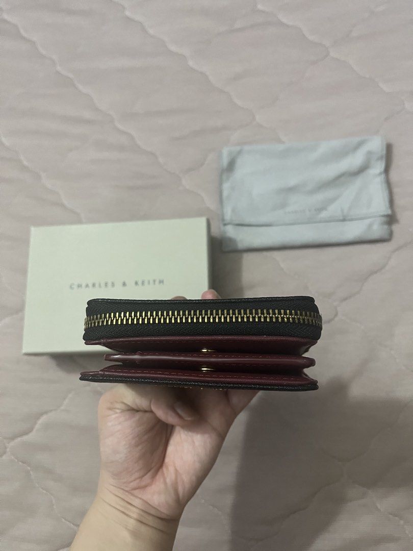 Charles & Keith Compact Zip Wallet Black (Category: Wallets & Card holders) located in Binan City. Submitted by tidytales (Listing ID 1459822520, Image 3). Description: - Brand: Charles & Keith - Type: Compact Zip Wallet - Material: Premium - Features: Spacious interior - Includes: Original box and dust bag - Ideal for: Everyday use.