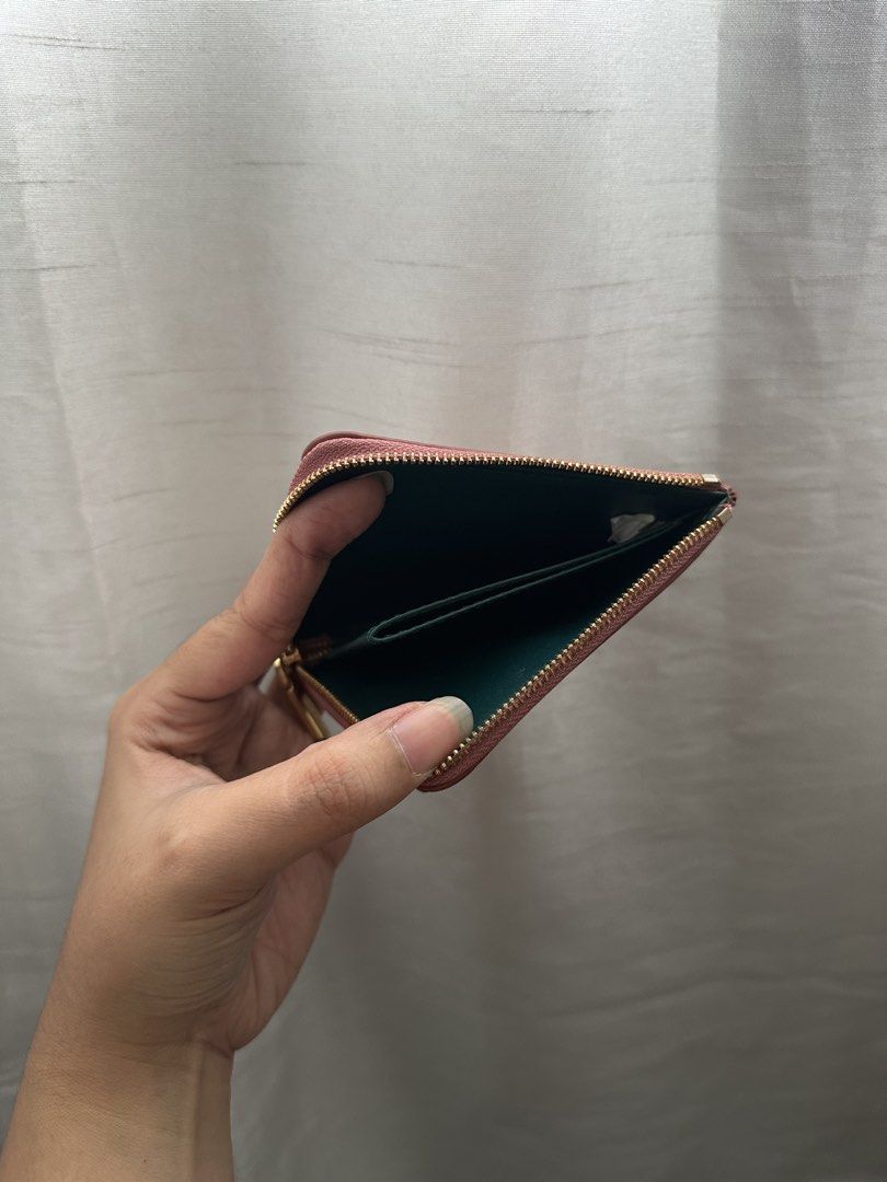 Charles & Keith Pink Card Holder with Zipper (Category: Wallets & Card holders) located in Quezon City. Submitted by ariee_01 (Listing ID 1459770962, Image 3). Description: - Cute pink card holder from Charles & Keith. - Features multiple card slots on the front. - Secure zipper closure for your essentials. - Small and compact design, fits easily in pockets or small bags. - Ideal for everyday use..