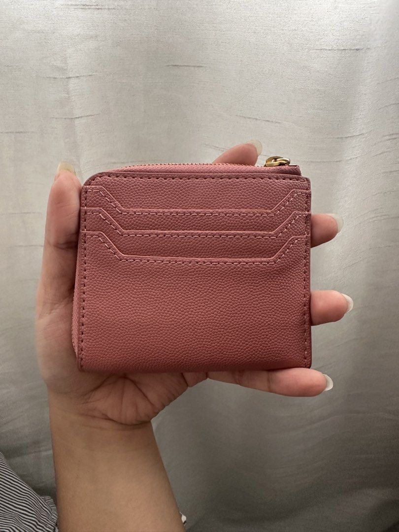 Charles & Keith Pink Card Holder with Zipper (Category: Wallets & Card holders) located in Quezon City. Submitted by ariee_01 (Listing ID 1459770962, Image 2). Description: - Cute pink card holder from Charles & Keith. - Features multiple card slots on the front. - Secure zipper closure for your essentials. - Small and compact design, fits easily in pockets or small bags. - Ideal for everyday use..