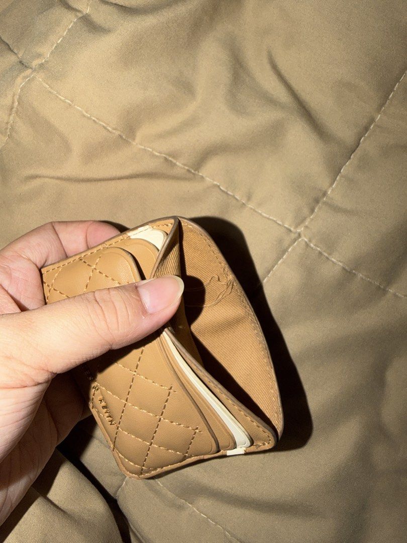 Charles & Keith Quilted Card Holder Tan (Category: Wallets & Card holders) located in Valenzuela. Submitted by royalstone_05 (Listing ID 1459754264, Image 3). Description: - Charles & Keith Tan Quilted Card Holder - Compact and fits multiple cards - Perfect for everyday use - Fits easily in pockets or small bags - Shows some signs of wear on the edges.