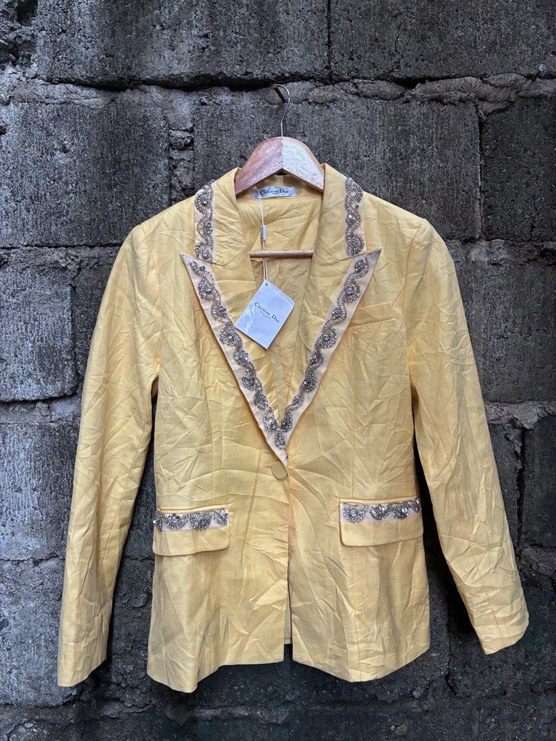 Christian Dior Yellow Beaded Blazer (Category: Luxury Apparel) located in Manila. Submitted by assortedgoodsv3 (Listing ID 1459719623, Image 1). Description: - Christian Dior blazer in a vibrant yellow. - Features stunning beadwork embellishments on the lapels and pockets. - Classic single-button closure. - A true statement piece, ideal for elevating any outfit. - Versatile for both formal and casual styling. - Comes with original tags attached..