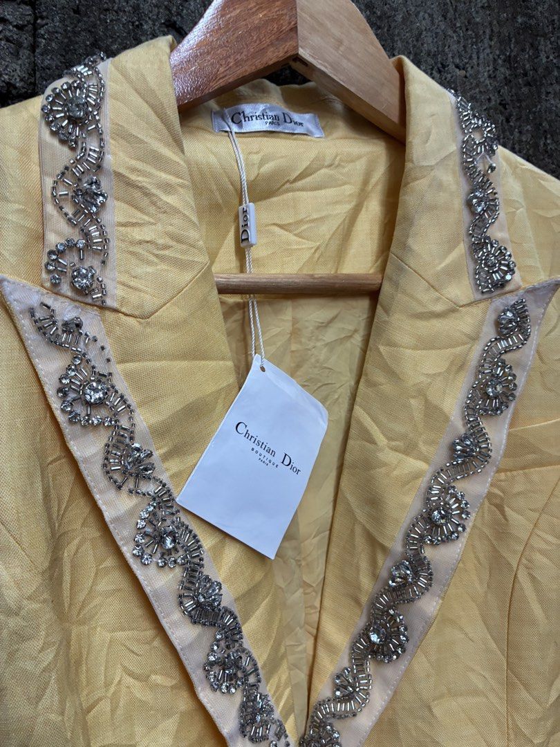 Christian Dior Yellow Beaded Blazer (Category: Luxury Apparel) located in Manila. Submitted by assortedgoodsv3 (Listing ID 1459719623, Image 2). Description: - Christian Dior blazer in a vibrant yellow. - Features stunning beadwork embellishments on the lapels and pockets. - Classic single-button closure. - A true statement piece, ideal for elevating any outfit. - Versatile for both formal and casual styling. - Comes with original tags attached..