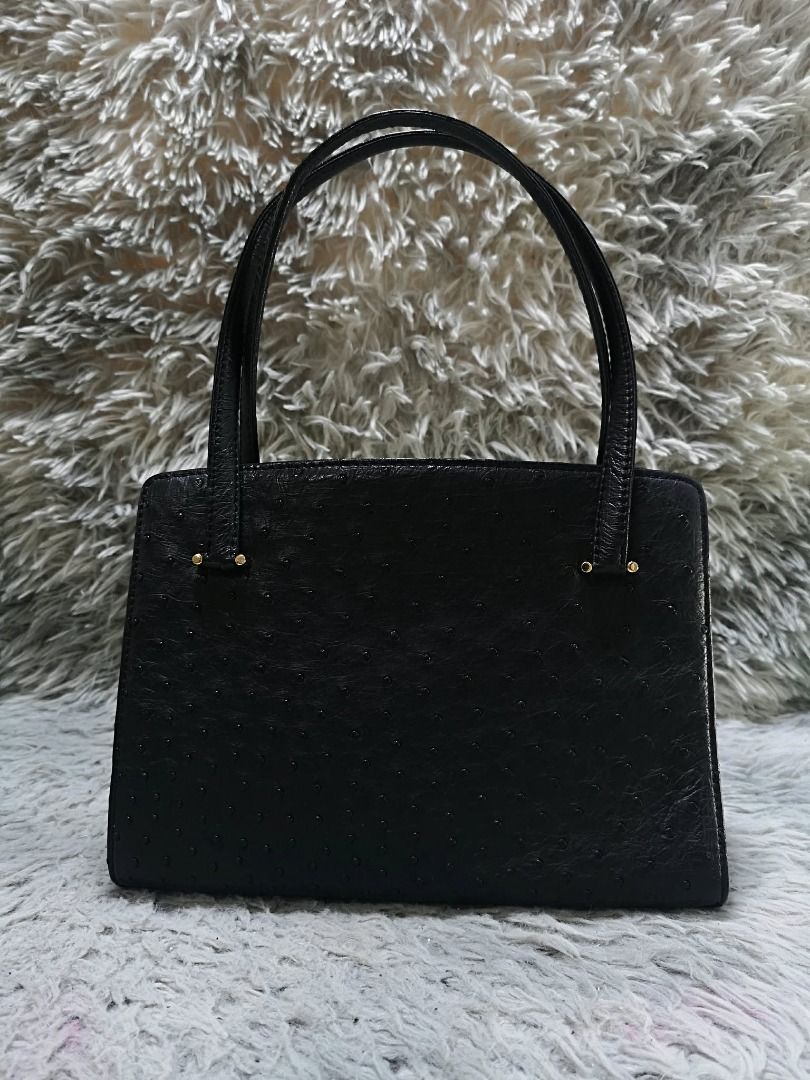 Classic Black Ostrich Leather Top Handle Bag (Category: Purses & Pouches) located in Santa Cruz. Submitted by jmy_surplus.2 (Listing ID 1459720799, Image 2). Description: Size ; L - 8 W - 10.2 Color ; Black Type ; Hand Bag Brand ; No brand Material ; Leather Style ; Black Ostrich leather Push Lock Closure Hand Bag LR 165 JMY 4 Batch #220 AVAILABLE.