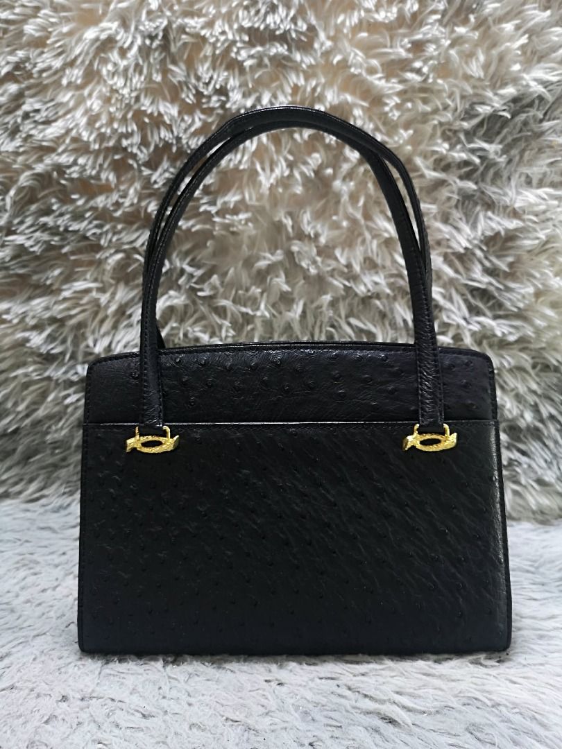 Classic Black Ostrich Leather Top Handle Bag (Category: Purses & Pouches) located in Santa Cruz. Submitted by jmy_surplus.2 (Listing ID 1459720799, Image 1). Description: Size ; L - 8 W - 10.2 Color ; Black Type ; Hand Bag Brand ; No brand Material ; Leather Style ; Black Ostrich leather Push Lock Closure Hand Bag LR 165 JMY 4 Batch #220 AVAILABLE.