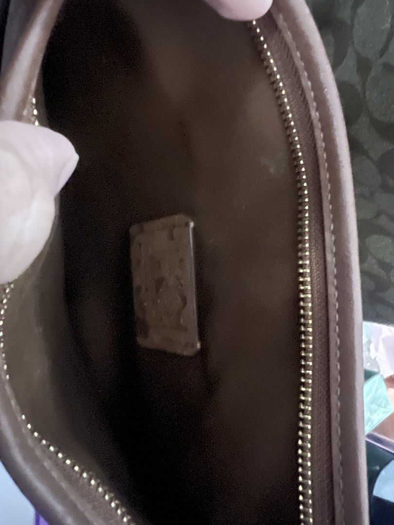 Coach (Category: Cross-body Bags) located in Tarlac. Submitted by araolalia (Listing ID 1459756138, Image 3). Description: Coach Signature Crossbody Bag 🤎 Preloved Coach Signature Canvas Crossbody Bag in a classic brown/tan color combination. Featuring the iconic Coach “C” signature print, leather-look trim, front zippered pocket, and a long adjustable crossbody strap. It also has the classic Coach logo hardware and a cute hanging Coach tag. ✨ D