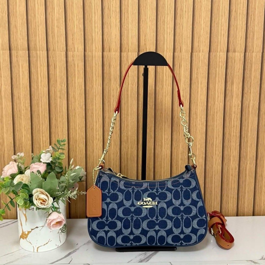 COACH DENIM (Category: Luxury Bags & Wallets) located in Manila. Submitted by luxujeaem (Listing ID 1459816428, Image 1). Description: Mga sis! ✨ Check out this super chic COACH DENIM shoulder bag, perfect for your everyday look! The denim material with the classic Coach monogram is just everything! Plus, it has a cute chain strap with leather accents for that extra touch of style. Perfect size for your essentials, whether you're going out for co