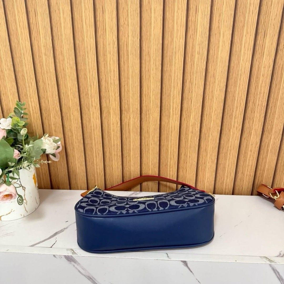 COACH DENIM (Category: Luxury Bags & Wallets) located in Manila. Submitted by luxujeaem (Listing ID 1459816428, Image 3). Description: Mga sis! ✨ Check out this super chic COACH DENIM shoulder bag, perfect for your everyday look! The denim material with the classic Coach monogram is just everything! Plus, it has a cute chain strap with leather accents for that extra touch of style. Perfect size for your essentials, whether you're going out for co