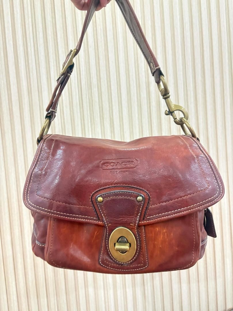 Coach Legacy Ali 65th Anniversary Lined (Category: Shoulder Bags) located in Manila. Submitted by cllnclvclls (Listing ID 1459842213, Image 1). Description: - Rare Vintage Coach brown leather shoulder bag - Interior lining with colorful stripes - Brass hardware details - Adjustable strap with buckle - Ideal for everyday use.