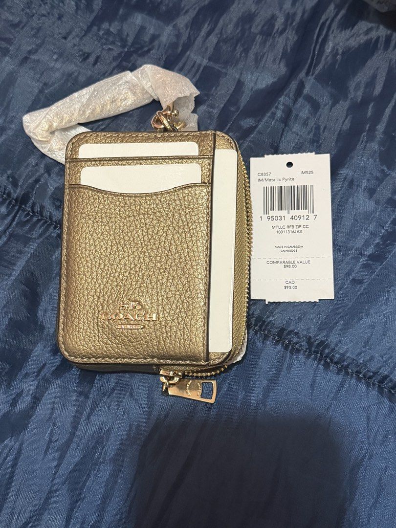Coach Metallic Pyrite Zip Card Holder C8357 (Category: Wallets & Card holders) located in La Trinidad. Submitted by ace32010 (Listing ID 1459842144, Image 1). Description: - Authentic Coach card holder - Color: Metallic Pyrite - Closure: Zip around - Features: Multiple card slots - Condition: Brand new with original tags.