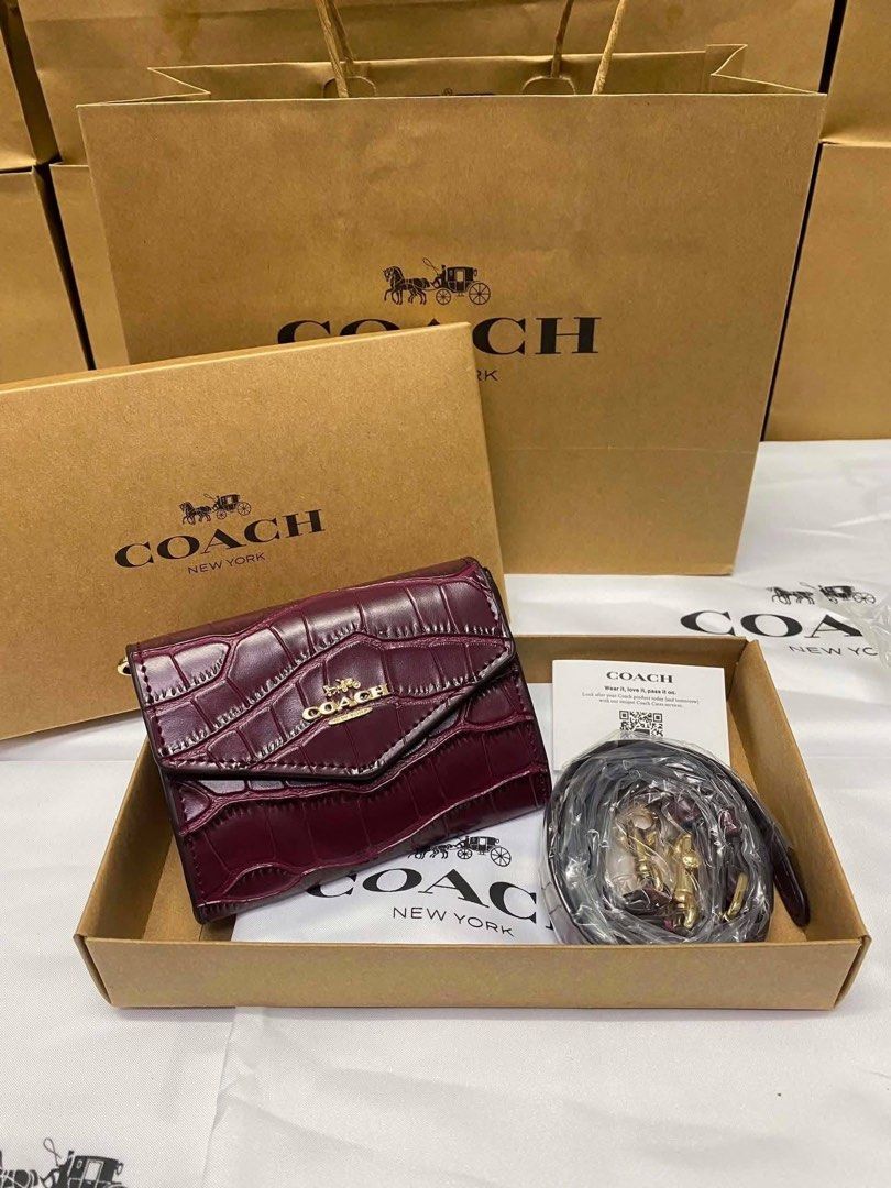 Coach Mini Envelope with Sling (Category: Wallets & Card holders) located in Binan City. Submitted by pinkykeenshop (Listing ID 1459867818, Image 1). Description: .