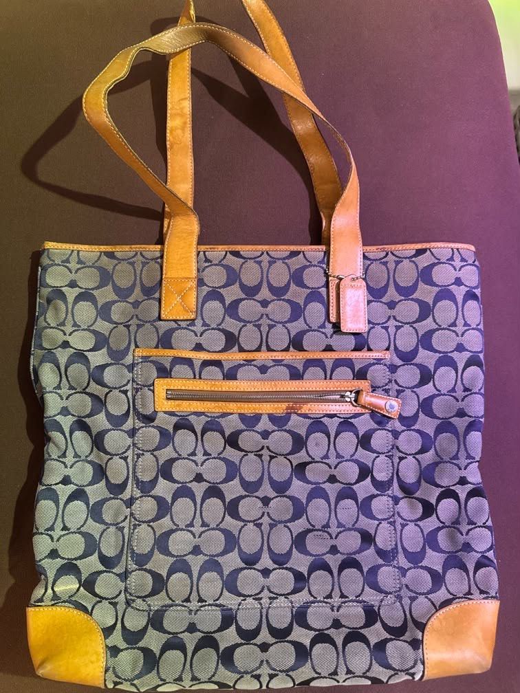 Coach Monogram Canvas Leather Trim Tote Bag (Category: Luxury Bags & Wallets) located in Davao. Submitted by rc130p (Listing ID 1459701254, Image 2). Description: - Classic Coach tote bag - Signature monogram canvas with leather trim and handles - Convenient zippered front pocket - Leather corners show some signs of wear and staining - Spacious interior for daily essentials - Ideal everyday bag.