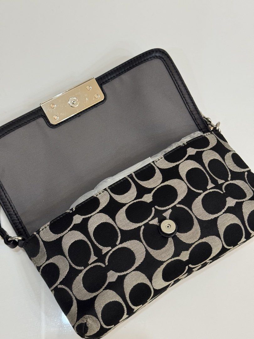 Coach Monogram Wristlet (Category: Luxury Bags & Wallets) located in Baliuag. Submitted by shaiilv (Listing ID 1459777460, Image 2). Description: RANK A - Almost new, with minor/hardly noticeable flaws and usually eliminated by bag spa treatment. - Silver hardware and clasp closure - You can buy a bag extender if you want the strap longer - With Interior card slots Policy Guidelines: ♡ One-time payment (Gcash/Bank Transfer) or Installment (15days