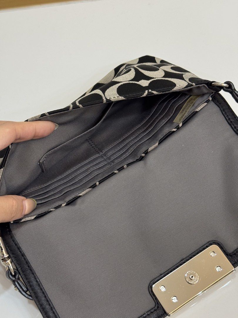 Coach Monogram Wristlet (Category: Luxury Bags & Wallets) located in Baliuag. Submitted by shaiilv (Listing ID 1459777460, Image 3). Description: RANK A - Almost new, with minor/hardly noticeable flaws and usually eliminated by bag spa treatment. - Silver hardware and clasp closure - You can buy a bag extender if you want the strap longer - With Interior card slots Policy Guidelines: ♡ One-time payment (Gcash/Bank Transfer) or Installment (15days