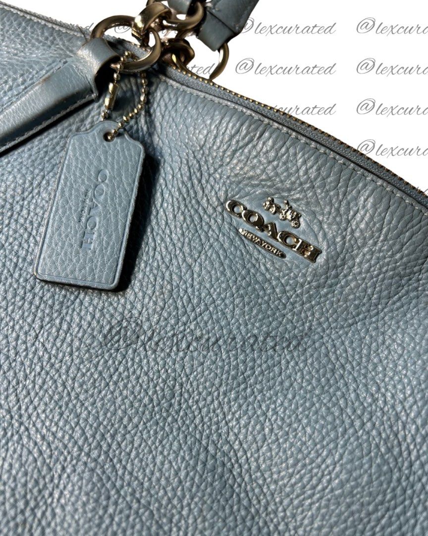 Coach Pebbled Leather Tote Bag - Light Blue (Category: Shoulder Bags) located in Manila. Submitted by lexcurated (Listing ID 1459854150, Image 2). Description: - Brand: Coach - Color: Light Blue - Material: Leather - Hardware: Silver - Closure: Zip Top - Straps: Two Shoulder Straps - Features: Coach Hangtag, Spacious Interior - Style: Great Everyday Tote Bag.
