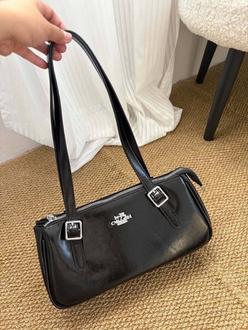 Coach Shoulder Bag - Black, White, Brown (Category: Shoulder Bags) located in Manila. Submitted by miesham_luxe07 (Listing ID 1459705237, Image 3). Description: - Classic Coach Shoulder Bag - Available in Black, White, and Dark Brown - Secure zip closure - Adjustable buckle straps on the front - Elegant silver hardware - Ideal for everyday essentials or a night out.