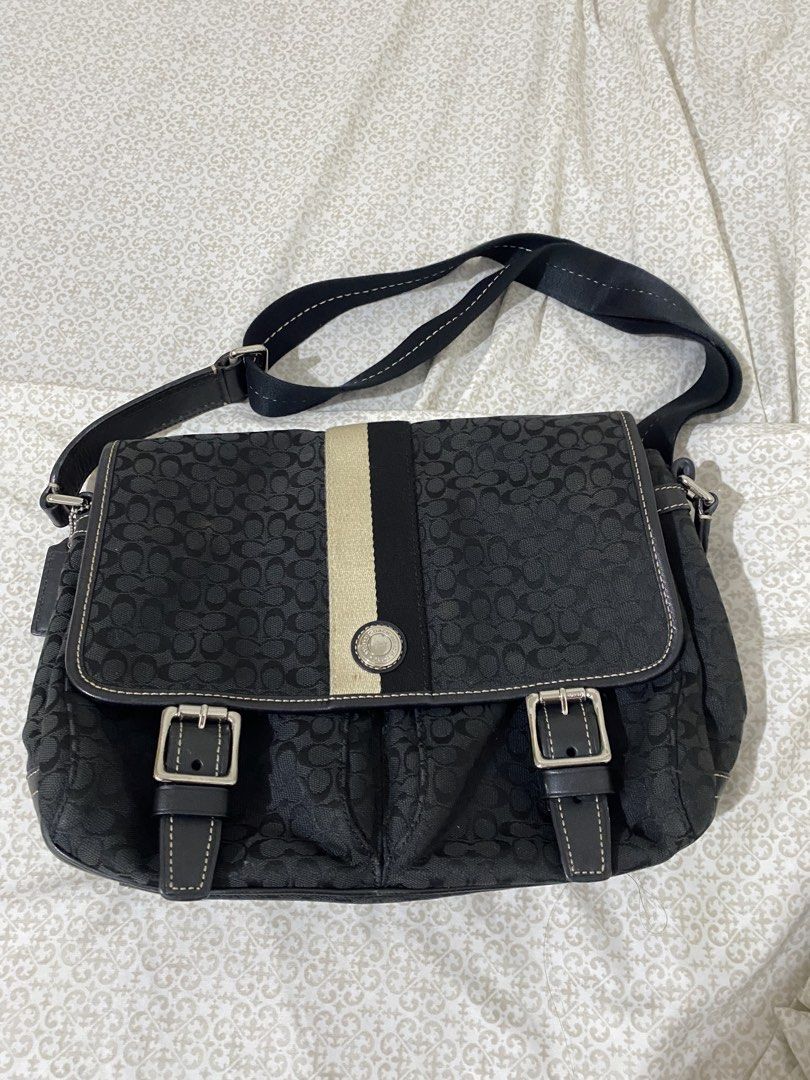 Coach Signature Monogram Messenger Bag Black (Category: Luxury Bags & Wallets) located in Quezon City. Submitted by irldn_ (Listing ID 1459885494, Image 1). Description: - Authentic Coach messenger bag - Signature black monogram pattern - Beige and black stripe detail on front flap - Adjustable shoulder strap - Multiple interior pockets, including a zippered compartment - Leather trim and buckle details - Clean blue interior lining 📩DM for price