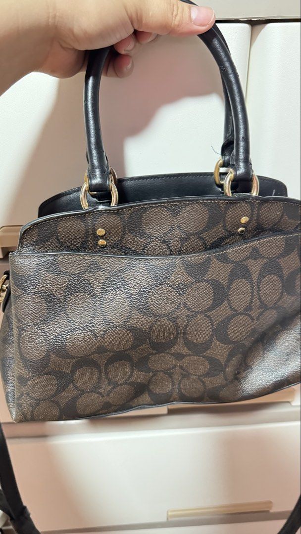 Coach Signature Monogram Satchel Bag (Category: Luxury Bags & Wallets) located in Manila. Submitted by ririkah (Listing ID 1459898578, Image 3). Description: - Classic Coach satchel bag - Brown signature monogram canvas - Black leather trim - Gold hardware details - Top handles - Detachable crossbody strap - Zipper closure - Spacious interior - Great for everyday use.