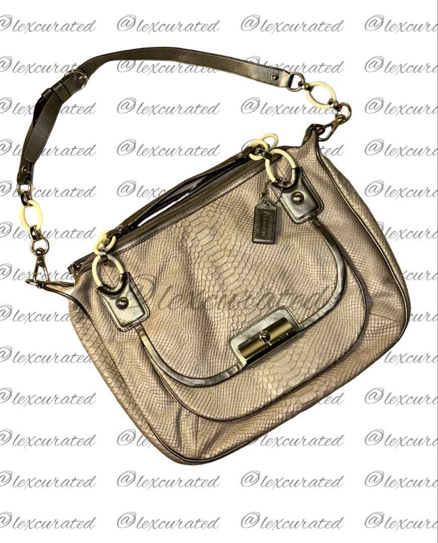 Coach Snakeskin Embossed Leather Shoulder Bag (Category: Luxury Bags & Wallets) located in Manila. Submitted by lexcurated (Listing ID 1459852256, Image 1). Description: - Gold-tone Coach shoulder bag - Snakeskin embossed leather exterior - Secure front flap with turn-lock closure - Luxurious teal satin interior lining - Stylish chain-link strap detail - Ideal for everyday use and adding a touch of flair.